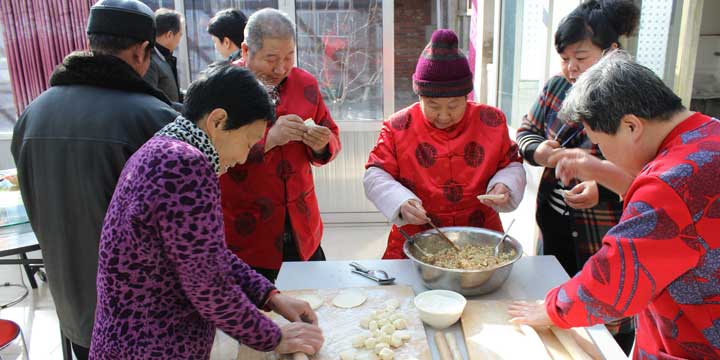 Family making dumpling together Family making dumpling together