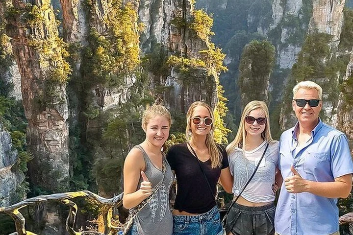 Travelers overlooking the sandstone mountains of Zhangjiajie